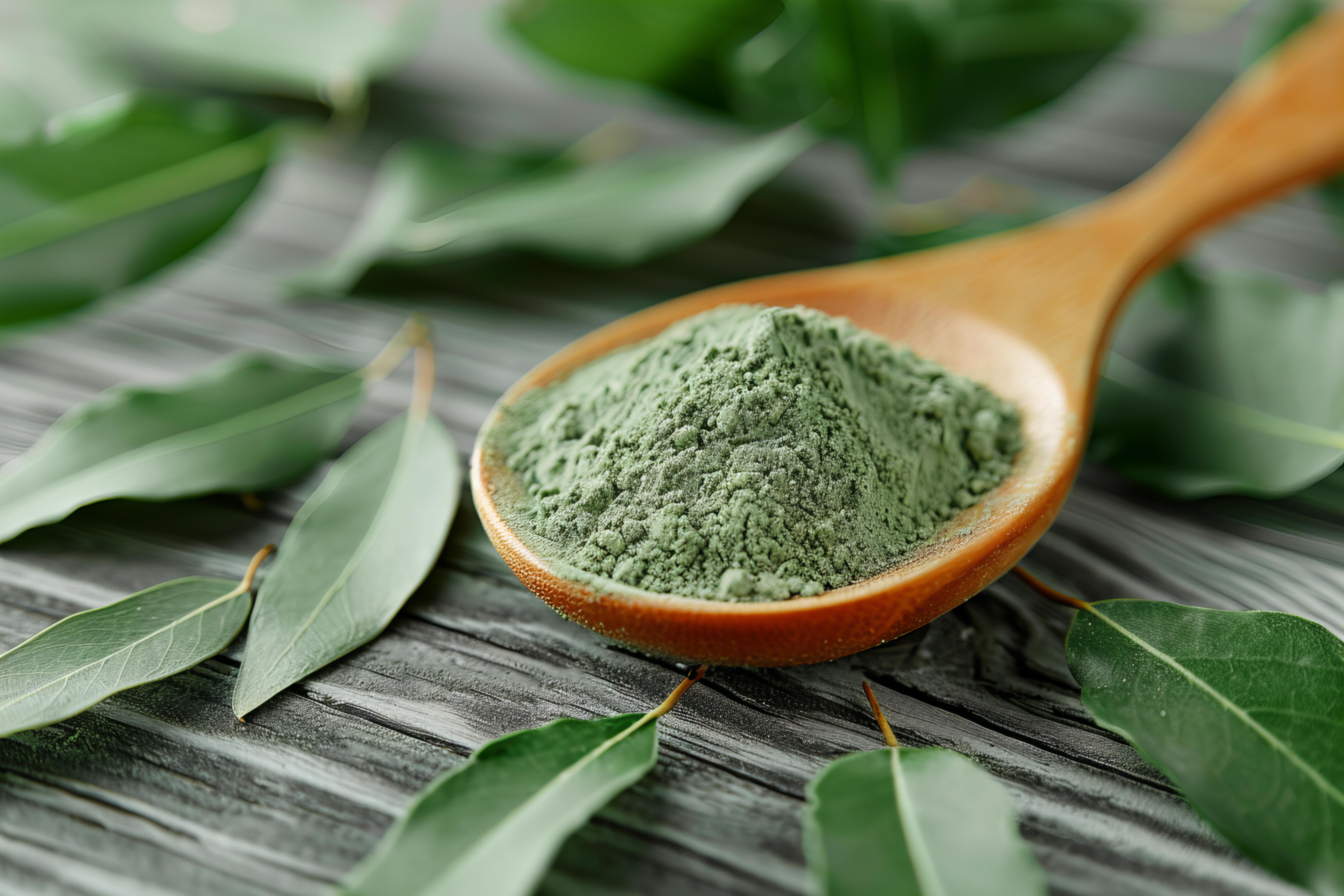 wooden-spoon-with-green-substance-it-wooden-spoon-with-leaves